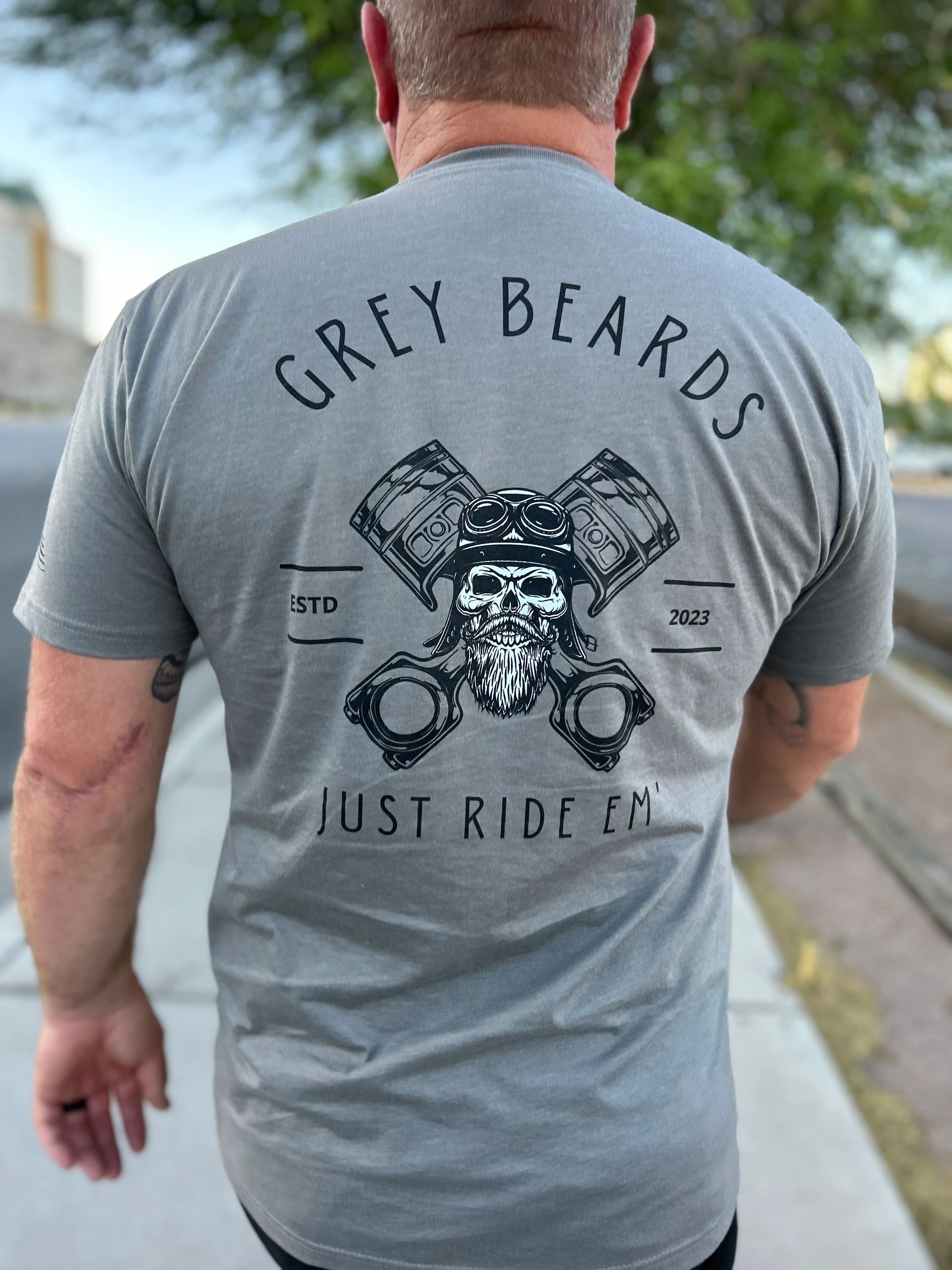 Man wearing Grey Beards "Just Ride 'Em" t-shirt