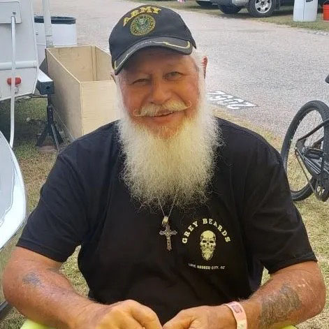 Man wearing hat with grey beard and OG Grey Beards black t-shirt