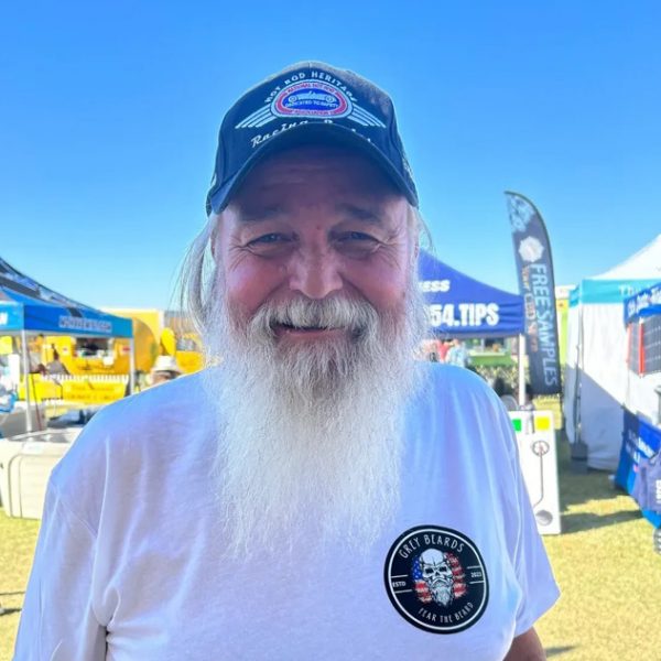 man with grey beard with hat and grey beards t-shirt